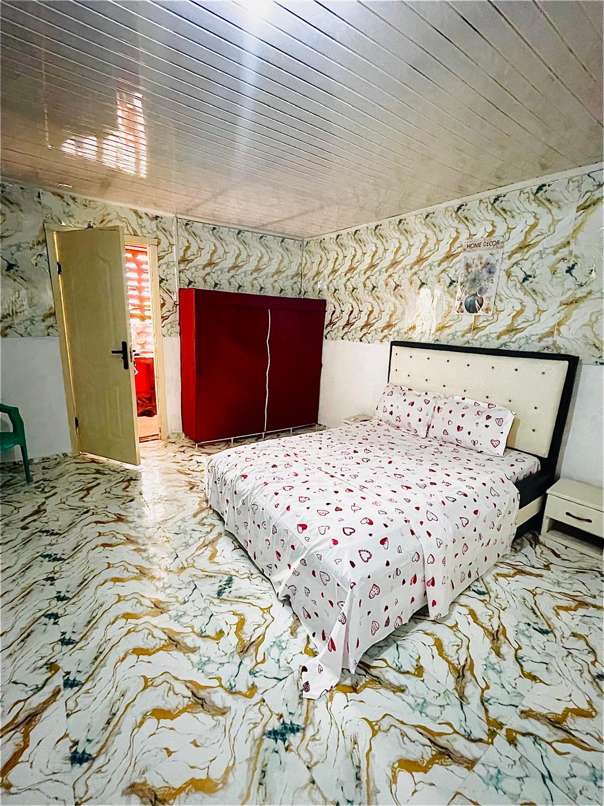 Double room with soft cushion mat flooring — Quiet Waters Guest House Lungi